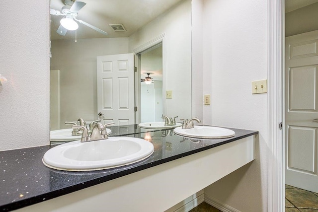 bathroom with vanity and tile patterned floors