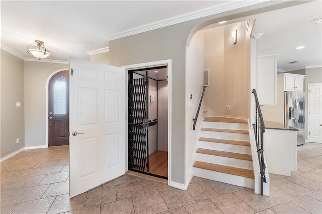 staircase with baseboards, arched walkways, and crown molding