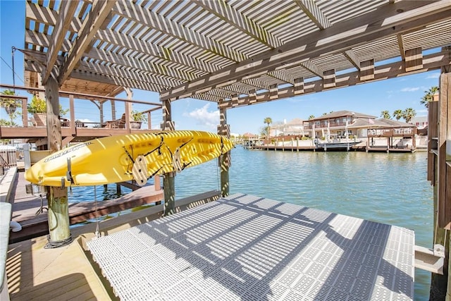 dock area with a water view and a pergola