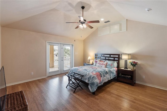 bedroom with wood finished floors, visible vents, access to exterior, vaulted ceiling, and french doors