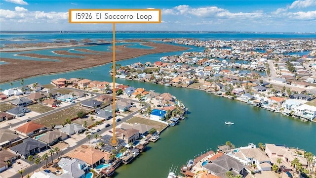 birds eye view of property featuring a water view and a residential view