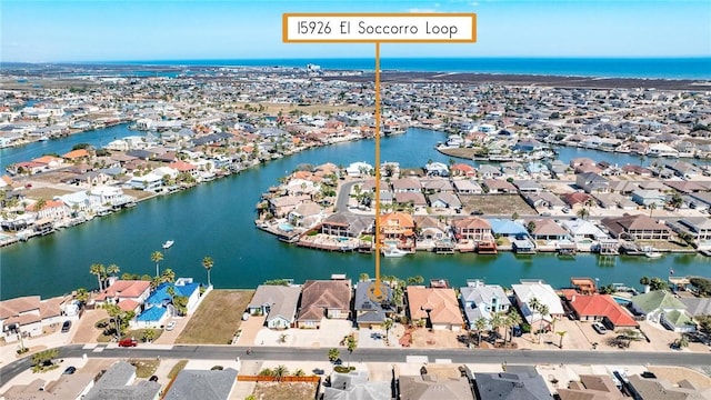 bird's eye view featuring a water view and a residential view