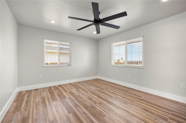 140 Port Saint Claire, Aransas Pass, TX 78336 - spare room featuring plenty of natural light, a ceiling fan, recessed lighting, light wood-style flooring, and baseboards