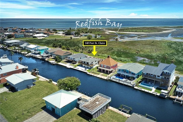 140 Port Saint Claire, Aransas Pass, TX 78336 - aerial view of residential area with a large body of water