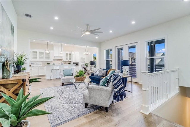 121 Frontside Dr, Corpus Christi, TX 78373 - living room featuring a ceiling fan, light wood finished floors, and recessed lighting