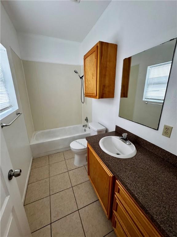 13958 Fortuna Bay Dr Unit C, Corpus Christi, TX 78418 - bathroom with vanity, tub / shower combination, and tile patterned floors