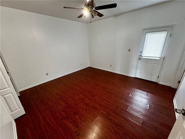 unfurnished room featuring dark hardwood / wood-style flooring and ceiling fan