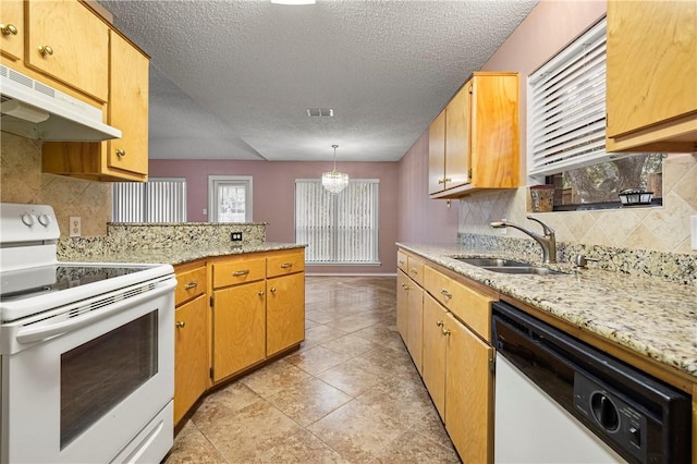 kitchen featuring sink, tasteful backsplash, hanging light fixtures, kitchen peninsula, and white appliances