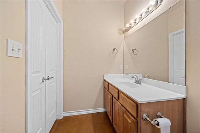 bathroom featuring vanity and baseboards