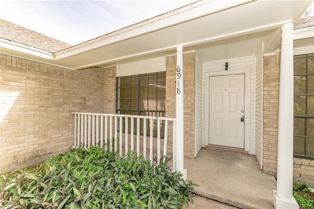 6918 Roseland Dr, Corpus Christi, TX 78414 - entrance to property featuring brick siding and a porch