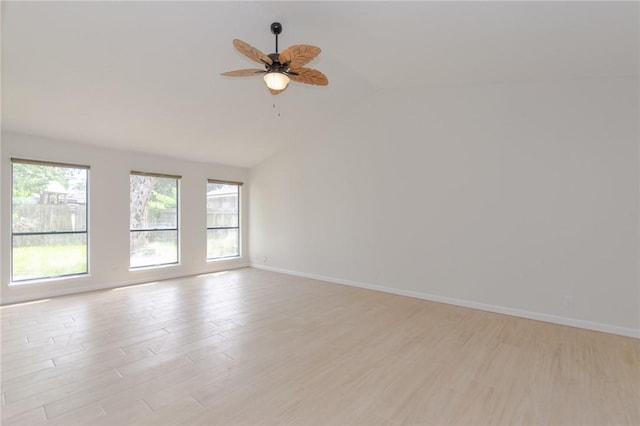 6918 Roseland Dr, Corpus Christi, TX 78414 - empty room with lofted ceiling, light wood finished floors, and a ceiling fan