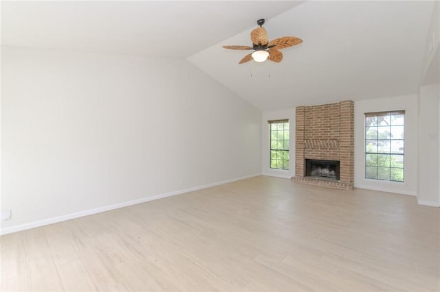 6918 Roseland Dr, Corpus Christi, TX 78414 - unfurnished living room featuring a ceiling fan, lofted ceiling, light wood-style flooring, and a fireplace