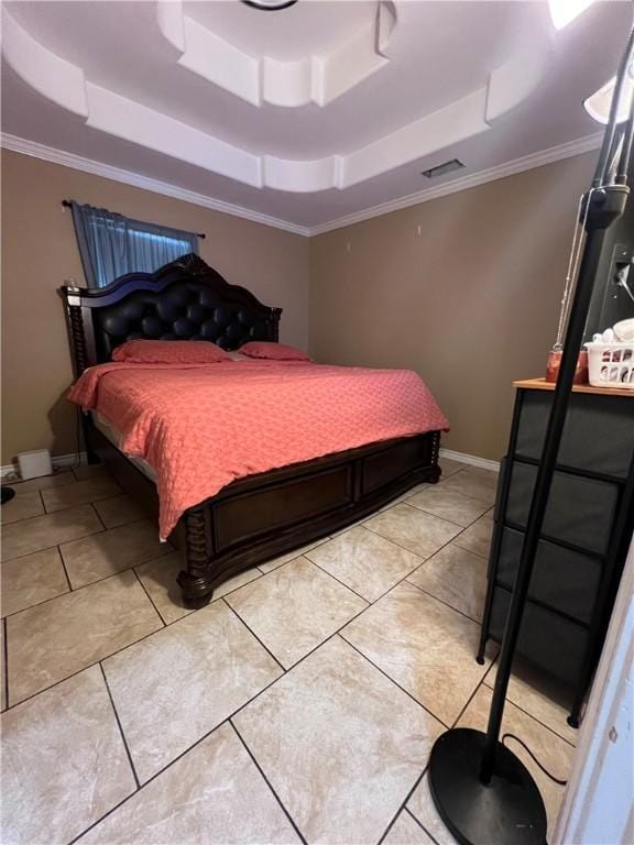 tiled bedroom with crown molding and a tray ceiling