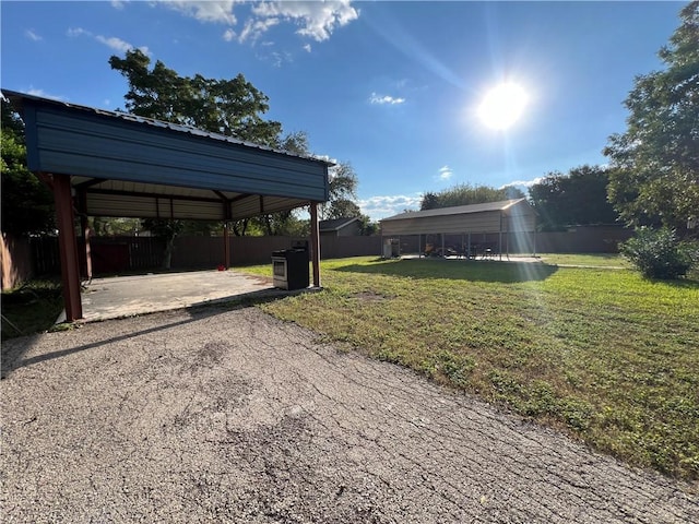 view of yard featuring a carport