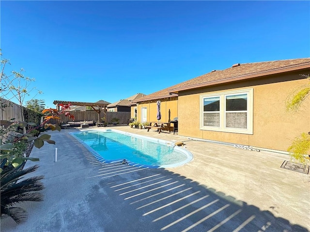 view of swimming pool with a pergola and a patio