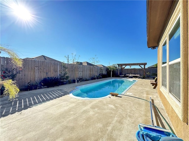 view of pool with a pergola and a patio area