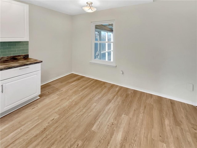 unfurnished dining area with light hardwood / wood-style floors