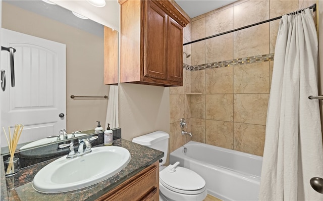 full bathroom with vanity, toilet, and shower / tub combo with curtain