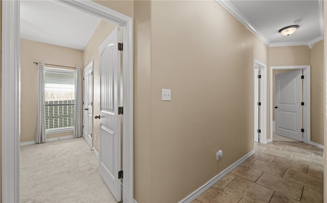 corridor featuring light carpet and crown molding