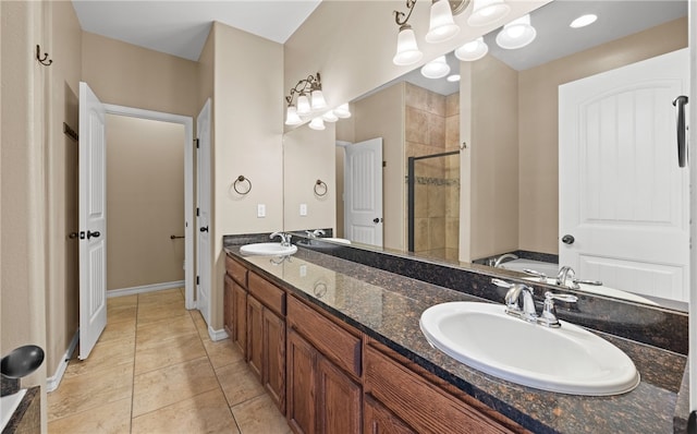 bathroom featuring tile patterned flooring, shower with separate bathtub, and vanity