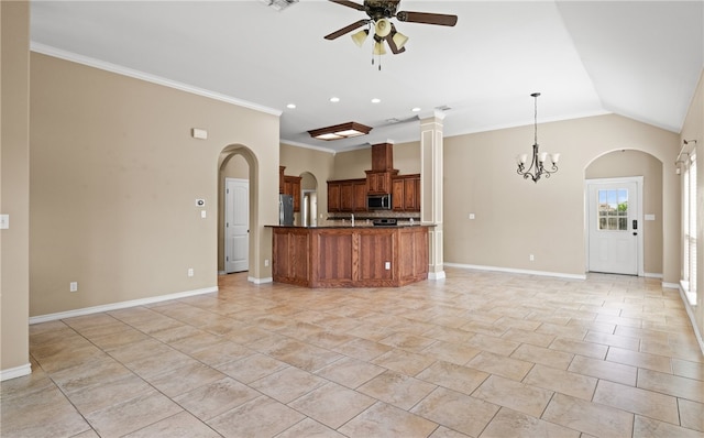 kitchen featuring ornamental molding, stainless steel appliances, hanging light fixtures, lofted ceiling, and ceiling fan with notable chandelier