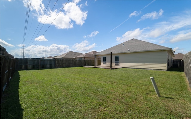 rear view of property featuring a yard