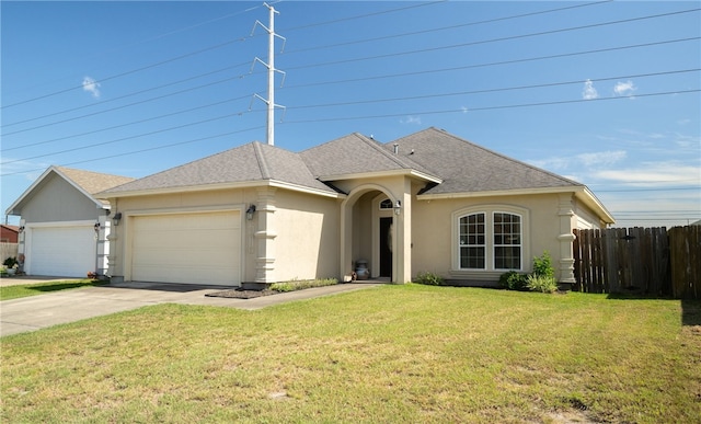 ranch-style home featuring a garage and a front lawn