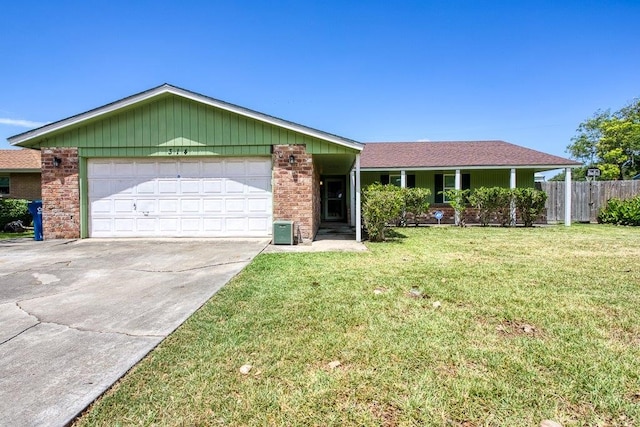 single story home with a garage and a front yard