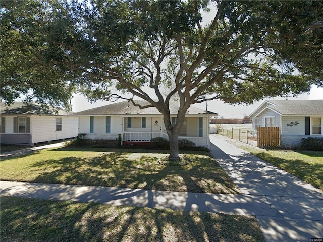 ranch-style house with a front lawn