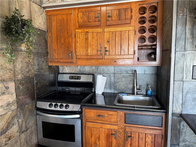 kitchen featuring tasteful backsplash, sink, and stainless steel electric range