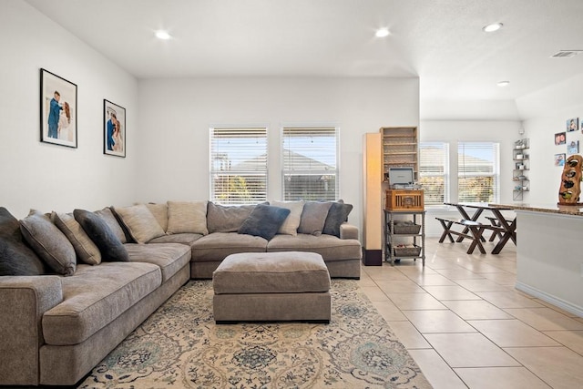 living room with light tile patterned flooring