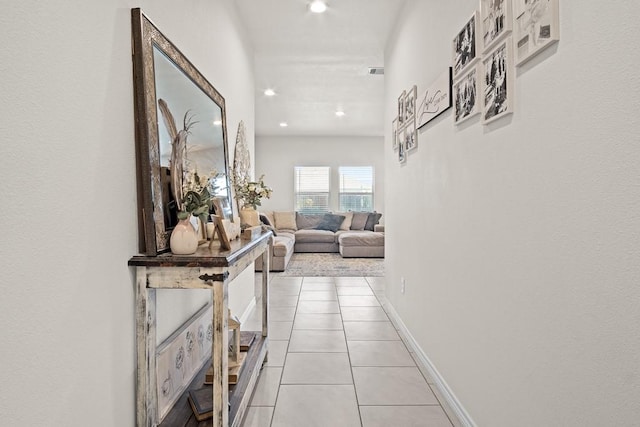 hall with light tile patterned flooring