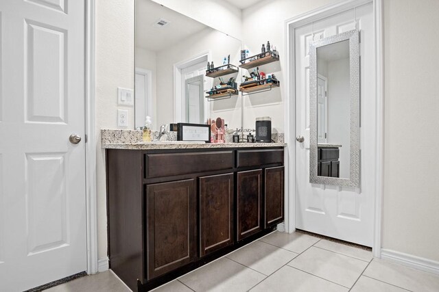 bathroom featuring tile patterned floors and vanity