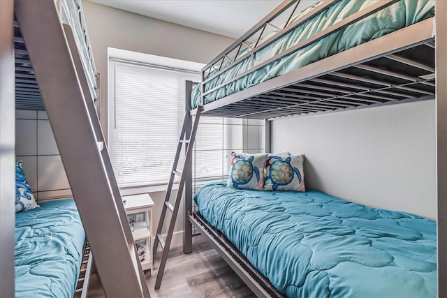 bedroom with hardwood / wood-style flooring