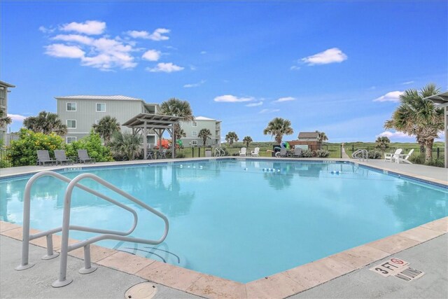 view of pool with a patio area and a pergola