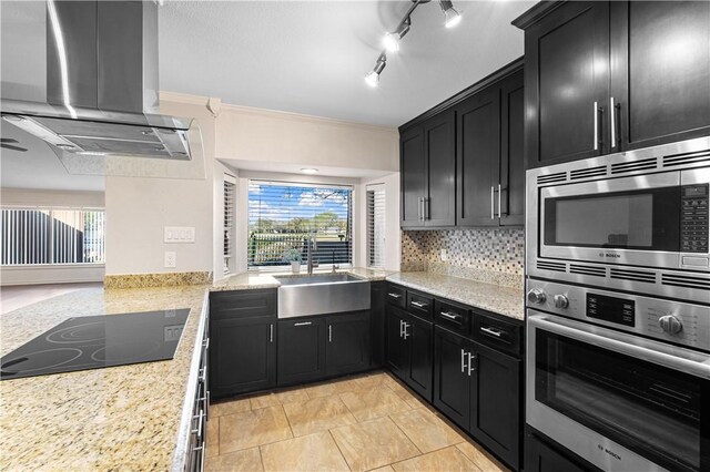 kitchen with black electric stovetop, island range hood, dishwasher, kitchen peninsula, and sink