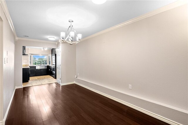 dining room with dark wood-type flooring, a chandelier, and ornamental molding