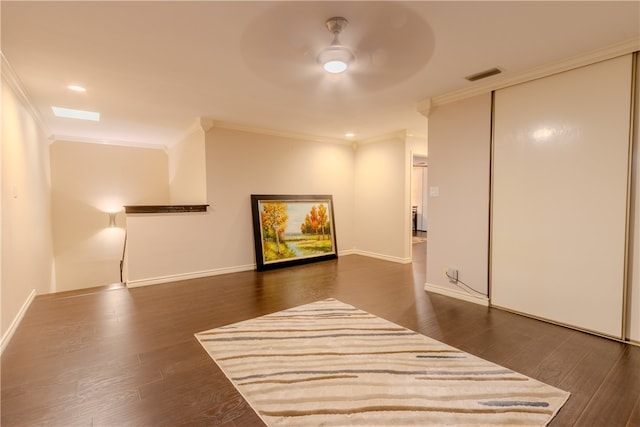 hall with dark hardwood / wood-style floors and crown molding