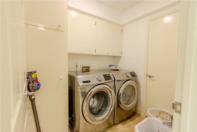 laundry area featuring cabinets and independent washer and dryer