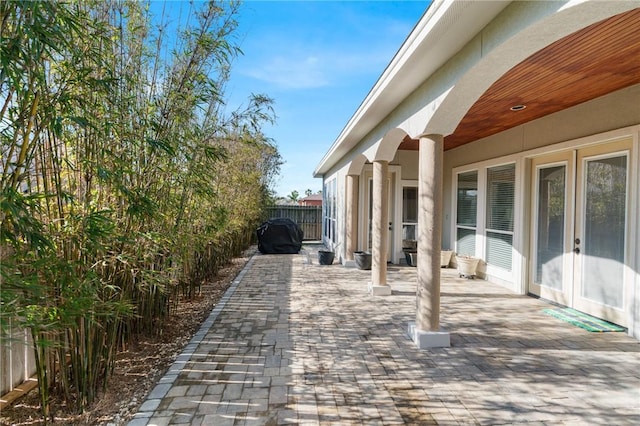 view of patio featuring fence