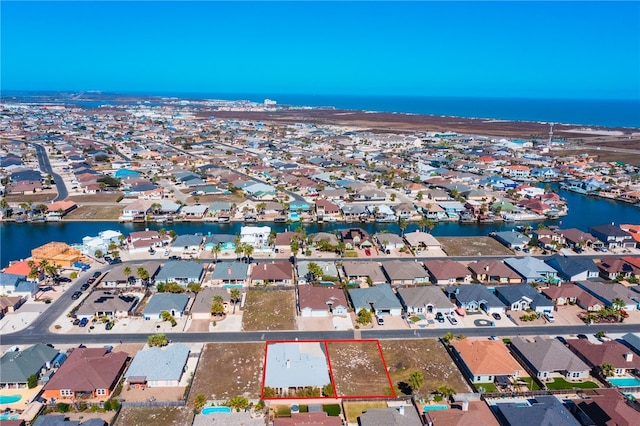 aerial view with a water view and a residential view