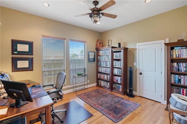 office featuring ceiling fan, baseboards, wood finished floors, and recessed lighting