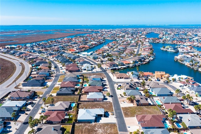 birds eye view of property featuring a residential view and a water view