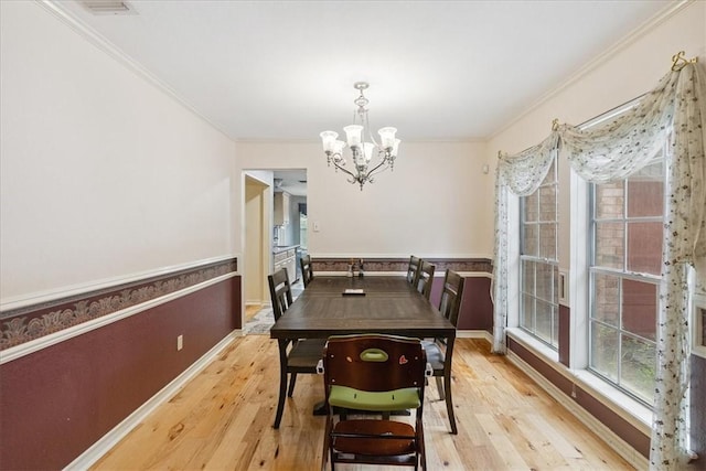 4537 Silver Hollow Dr, Corpus Christi, TX 78413 - dining area featuring a chandelier, crown molding, and light wood-type flooring