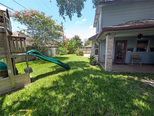 4537 Silver Hollow Dr, Corpus Christi, TX 78413 - fenced backyard with a playground, ceiling fan, and a patio