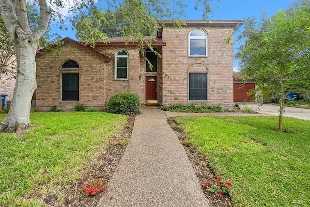 4537 Silver Hollow Dr, Corpus Christi, TX 78413 - view of front of property with a front yard, brick siding, and driveway