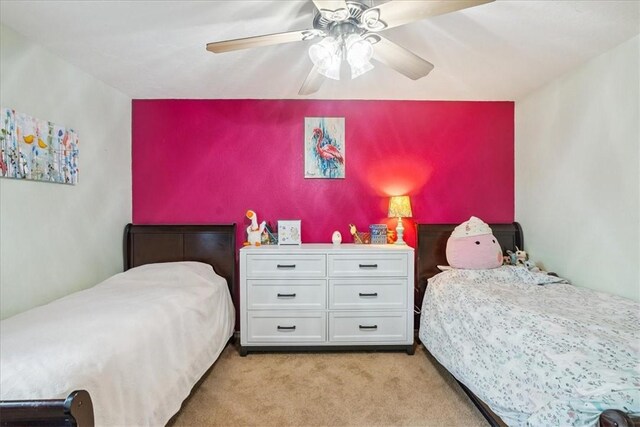 4537 Silver Hollow Dr, Corpus Christi, TX 78413 - bedroom with light colored carpet and ceiling fan