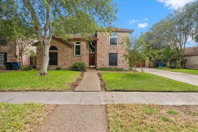 4537 Silver Hollow Dr, Corpus Christi, TX 78413 - view of front of property with brick siding, a front lawn, and concrete driveway