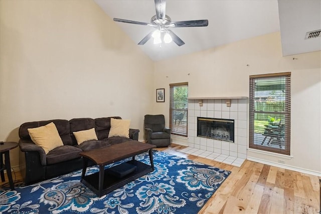 4537 Silver Hollow Dr, Corpus Christi, TX 78413 - living area with wood finished floors, a ceiling fan, high vaulted ceiling, and a fireplace