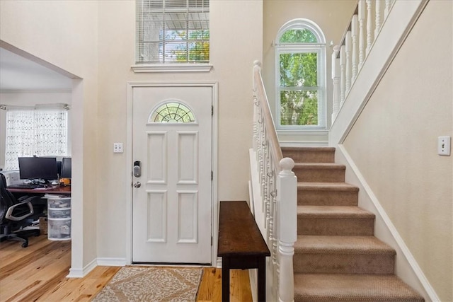 4537 Silver Hollow Dr, Corpus Christi, TX 78413 - entryway featuring wood finished floors, stairs, a high ceiling, and healthy amount of natural light
